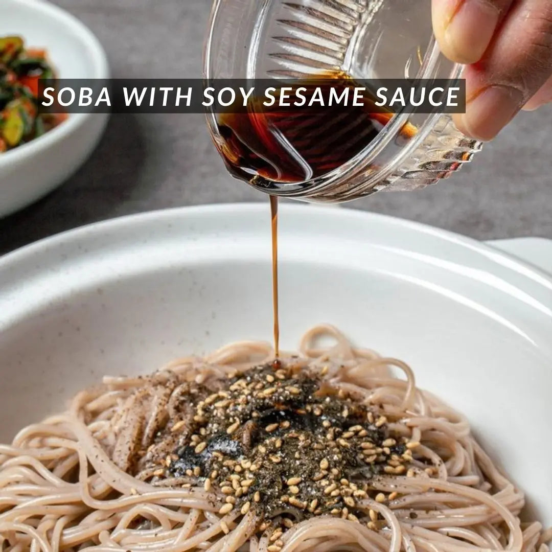 Pouring homemade sauce over soba noodles