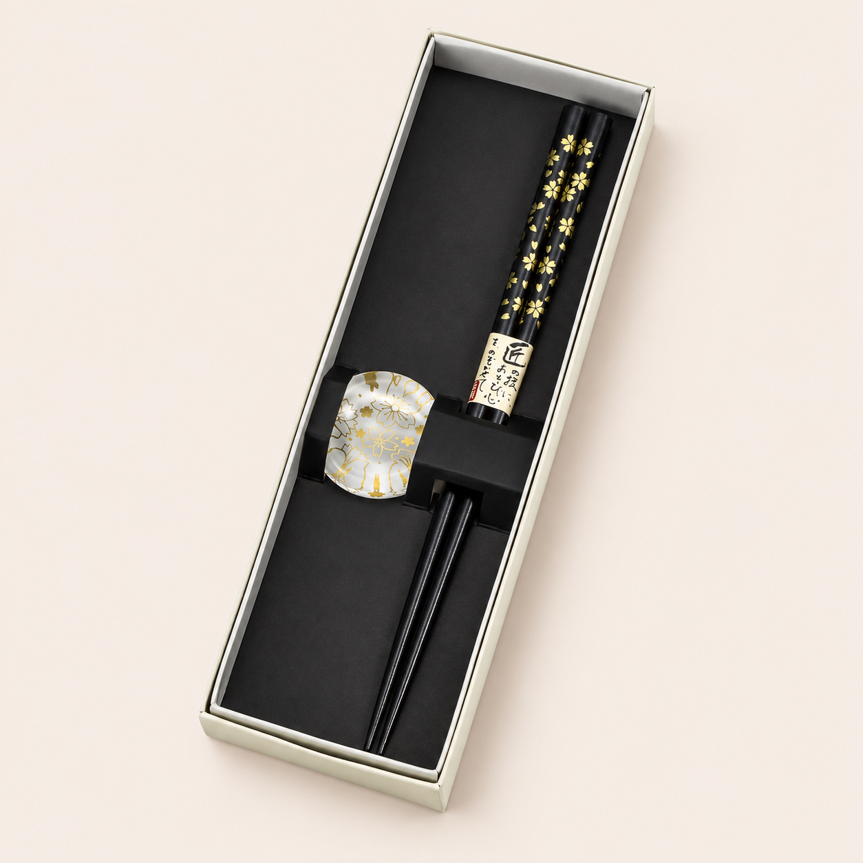 Japanese chopsticks gift set: black chopsticks with gold cherry blossom and clear rest in an open box