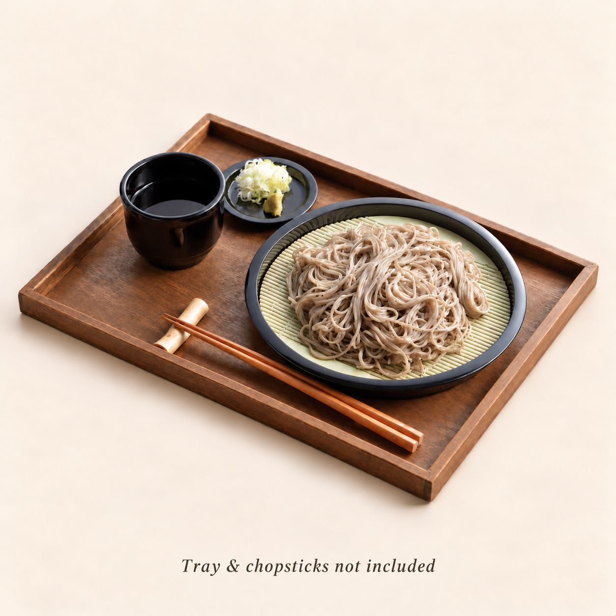 Japanese zaru soba set by Umami Food Studio: cold soba noodles on a drain mat with dipping sauce and wasabi